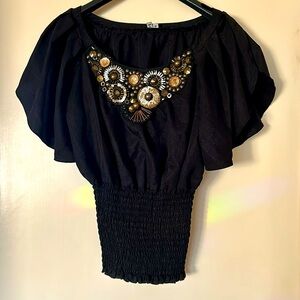 XOXO women’s feminine, sequined, boho style blouse.
